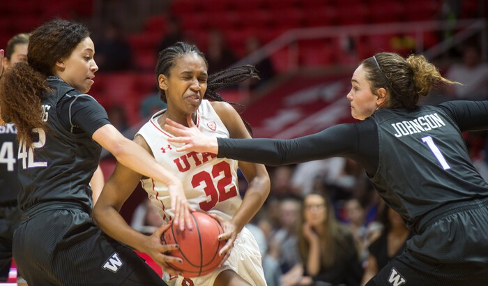 (Rick Egan  |  The Salt Lake Tribune)      Utah Utes forward Tanaeya Boclair (32) tries to get past Washington Huskies guard Mackenzie Wieburg (42) and  Hannah Johnson (1), in PAC-12 women's basketball action at the Jon M. Huntsman Center, Sunday, Feb. 18, 2018.