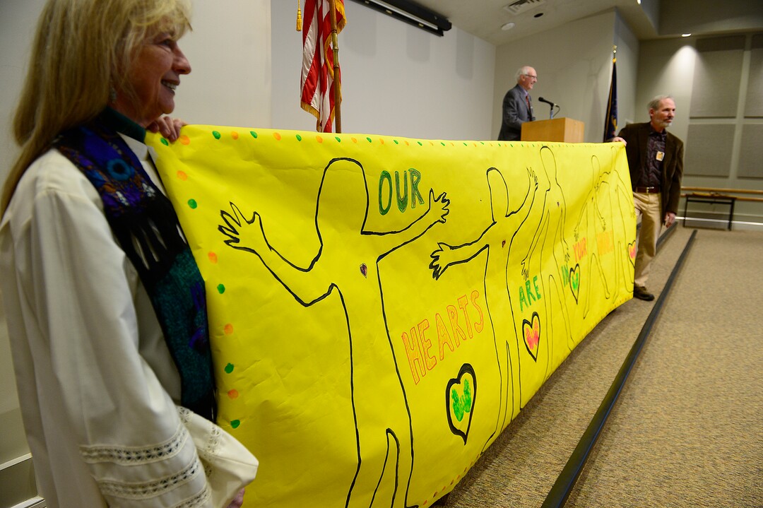 (Scott Sommerdorf   |  The Salt Lake Tribune)  Shesh Tipton of Holladay United Church of Christ, left, helps hold a banner that says "Our Hearts Are in Your Hands" at the "Faith & Poverty Day at the Utah Capitol, Thursday, January 25, 2018.
