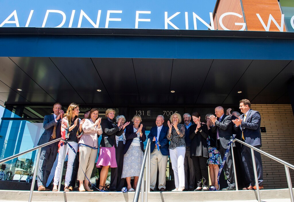 (Rick Egan  |  Tribune file photo) Pat King cuts the ribbon at the new Geraldine E. King Women's Resource Center on Friday, June 21, 2019. The center will service homeless women.