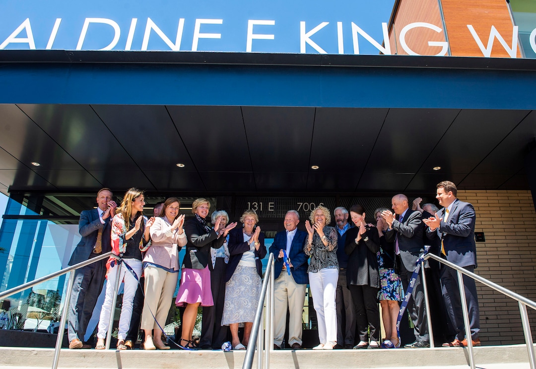 (Rick Egan  |  The Salt Lake Tribune)      Pat King cuts the ribbon at the  Geraldine E. King Women's Resource Center, one of three new shelters that will replace the Road Home. Friday, June 21, 2019.