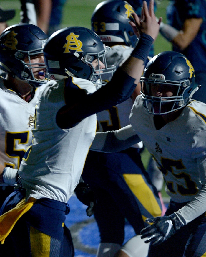 (Leah Hogsten | The Salt Lake Tribune) Summit Academy's quarterback Hayden Reynolds celebrates his touchdown. Summit Academy boys' football team leads Juan Diego High School 51-35 during their game, October 13, 2017 in Draper.