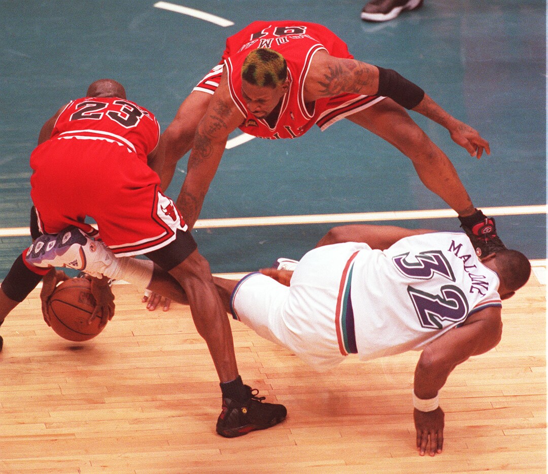 (Trent Nelson  |  Tribune file photo) Michael Jordan steals the ball from Karl Malone in the final seconds of the 1998 NBA Finals.