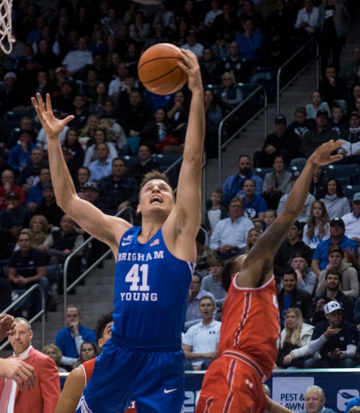 (Rick Egan  |  The Salt Lake Tribune) Brigham Young Cougars forward Luke Worthington (41) grabs a rebound over the top of Utah Utes guard Justin Bibbins (1),
in basketball action Utah Utes vs. Brigham Young Cougars at the Marriott Center in Provo, Saturday, December 15, 2017.



