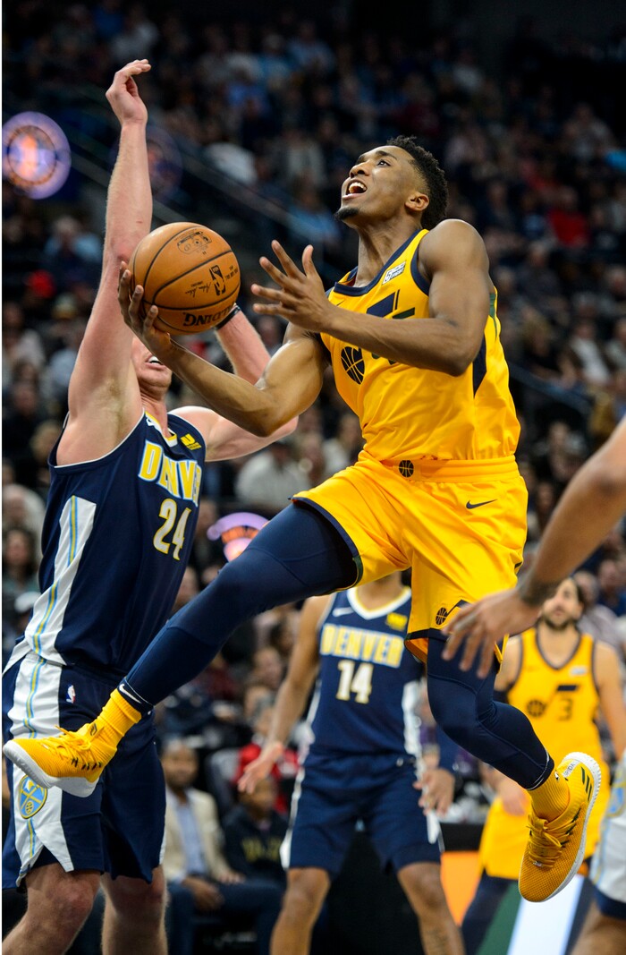 (Steve Griffin  |  The Salt Lake Tribune) Utah Jazz guard Donovan Mitchell (45) gets to the basket for two during the Utah Jazz versus Denver Nuggets NBA basketball game at Vivint Smart Home Arena  in Salt Lake City Tuesday November 28, 2017.