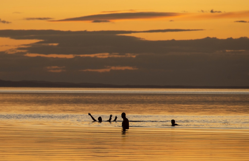 (Rick Egan  |  The Salt Lake Tribune)   Jim Platt, Adam Stevenson and Adam Beckstead from Centerville, UT, enjoy the warm fall weather as they float in the Great Salt Lake. Wednesday, Sept. 18, 2019.