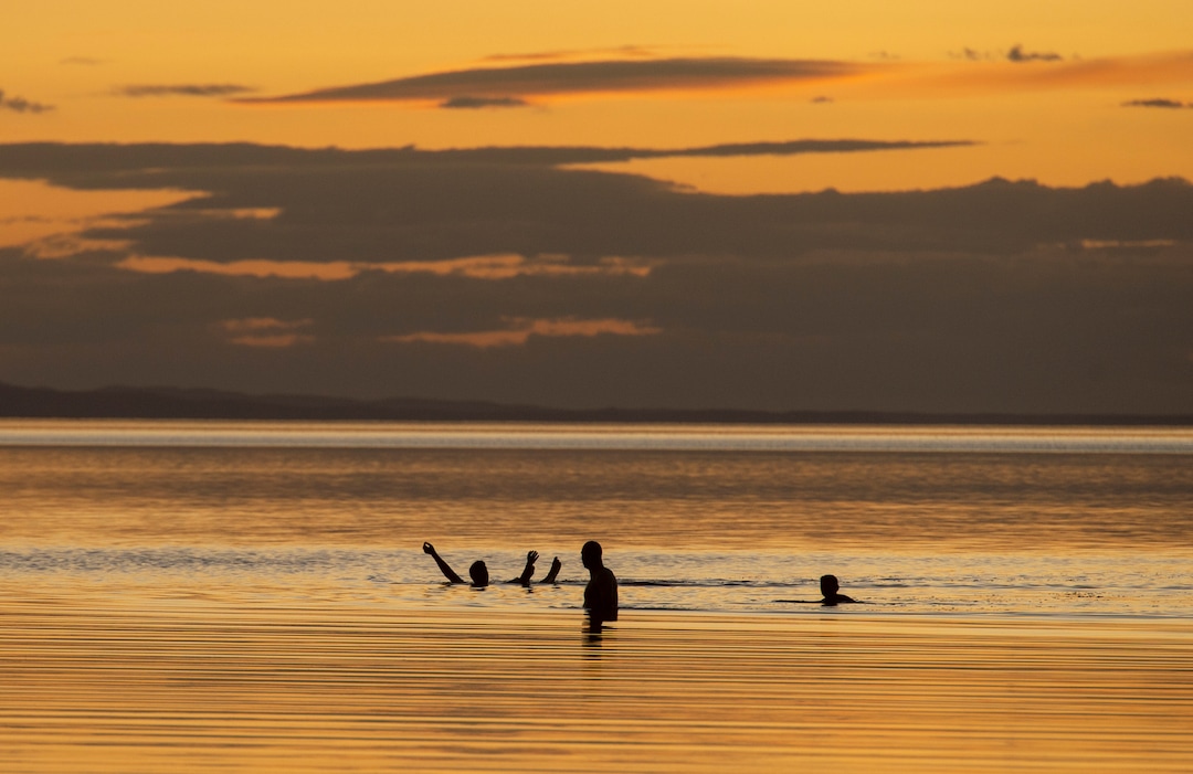 (Rick Egan  |  The Salt Lake Tribune)   Jim Platt, Adam Stevenson and Adam Beckstead from Centerville, UT, enjoy the warm fall weather as they float in the Great Salt Lake. Wednesday, Sept. 18, 2019.
