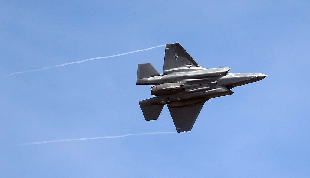 (Rick Bowmer | AP file photo) An F-35 jet flies over its new operational base at Hill Air Force Base, in northern Utah in 2015.