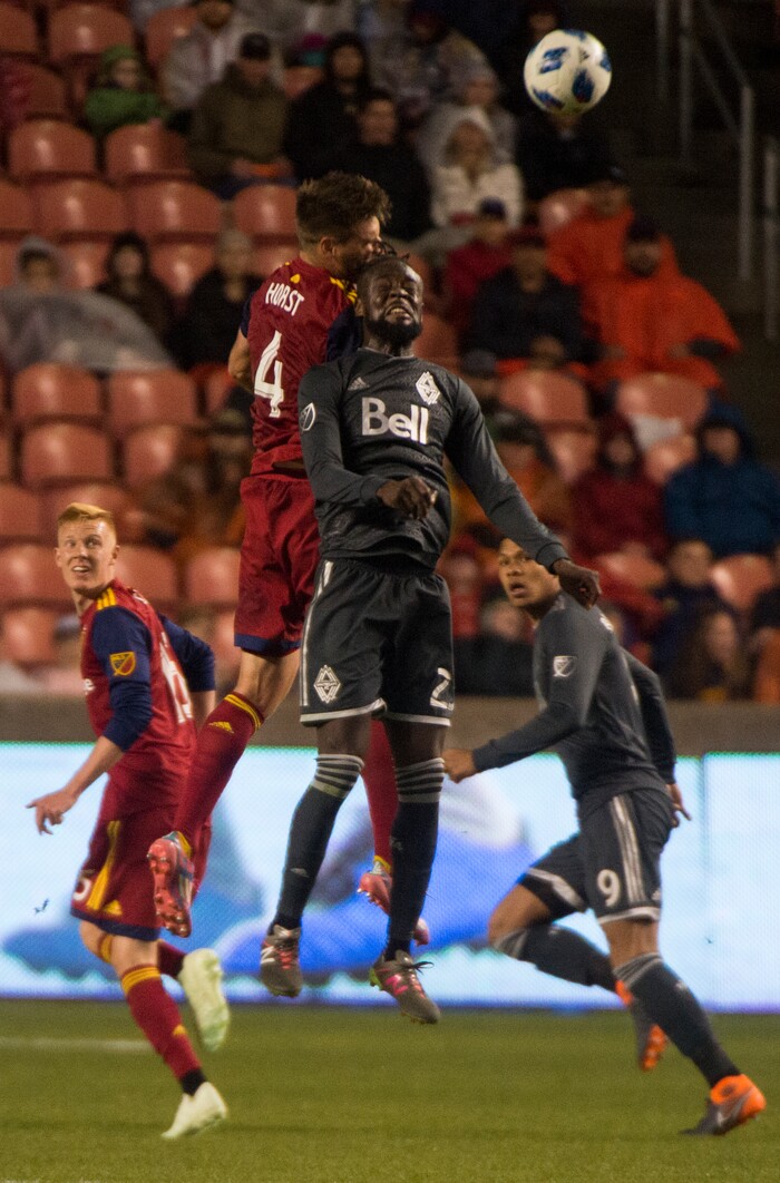 Rick Egan  |  The Salt Lake Tribune)        Real Salt Lake defender David Horst (4) goes for the ball along with Vancouver Whitecaps forward Kei Kamara (23), in MLS action at Rio Tinto Stadium, Saturday, April 7, 2018.


