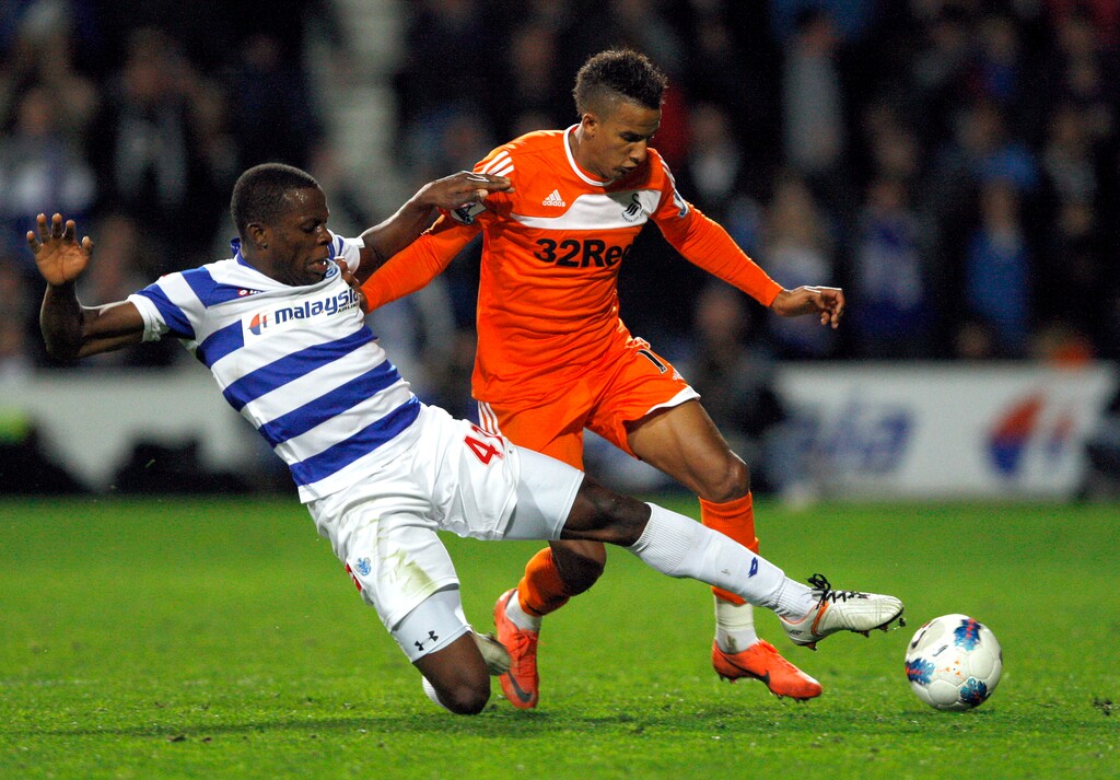 (Kristy Wigglesworth  |  AP Photo)  QPR's Nedum Onuoha, left, vies for the ball with Swansea's Scott Sinclair during the English Premier League soccer match between Queen's Park Rangers and Swansea City at Loftus Road Stadium in London, Wednesday, April 11, 2012.