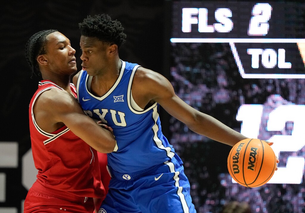 (Francisco Kjolseth | The Salt Lake Tribune) Utah Utes forward Kendyl Sanders (13) pressures BYU Cougars forward AJ Dybantsa (3) as Utah hosts BYU, NCAA basketball in Salt Lake City on Saturday, Jan. 10, 2026.