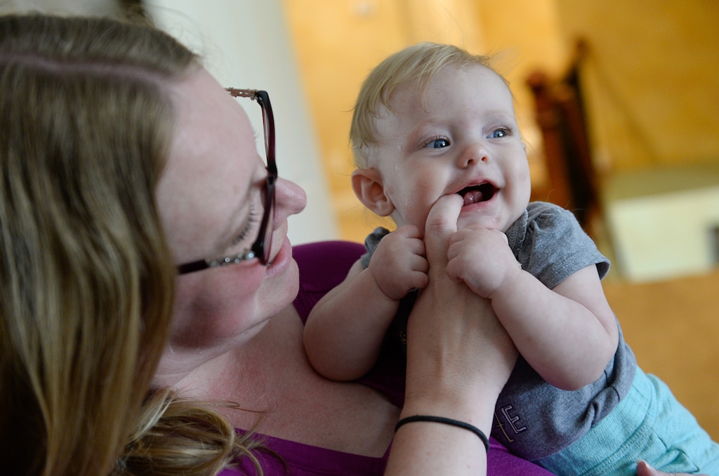 (Francisco Kjolseth | The Salt Lake Tribune) Lyndsay Carlson of Stansbury Park plays with her daughter Eve, who is nearly 5 months old, as she describes the experience of giving birth to her at home. The family wasn't able to fill an empty birthing pool in time because she started contractions so fast. According to a new report by the Utah Department of Health, more women are choosing to give birth outside hospitals.