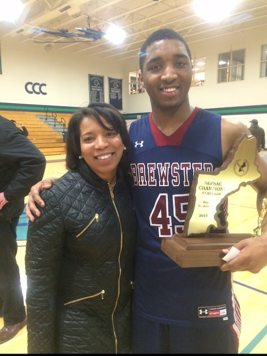 Donovan Mitchell poses with his mother, Nicole Mitchell, and a basketball conference championship he won at Brewster Academy as a senior in 2015. Mitchell won two prep national championships at Brewster and was class prefect. Courtesy of Nicole Mitchell.