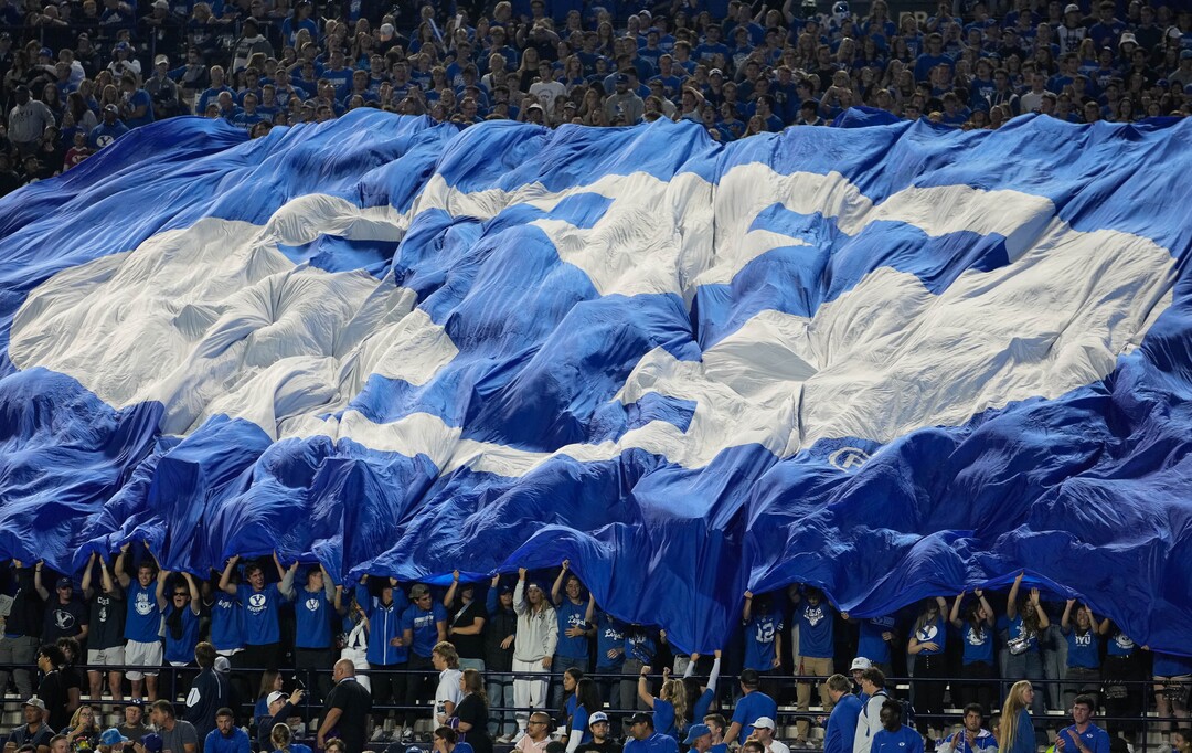 (Francisco Kjolseth | The Salt Lake Tribune) The student section drives up the decibel level during the game between the Brigham Young Cougars and the Wyoming Cowboys at LaVell Edwards Stadium in Provo, on Saturday, Sept. 24, 2022.