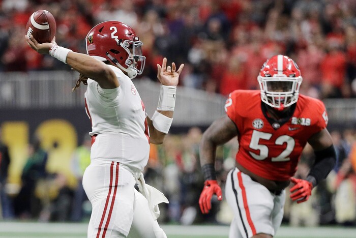 Alabama quarterback Jalen Hurts throws during the first half of the NCAA college football playoff championship game against Georgia Monday, Jan. 8, 2018, in Atlanta. (AP Photo/David J. Phillip)