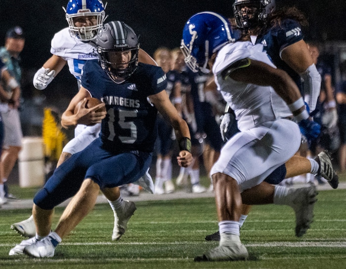 (Rick Egan | The Salt Lake Tribune) Corner Canyon quarterback Devin Brown (15), runs the ball for the Chargers, in  prep football action between the Corner Canyon Chargers and the Bingham Miners, on Friday, Aug. 27, 2021.