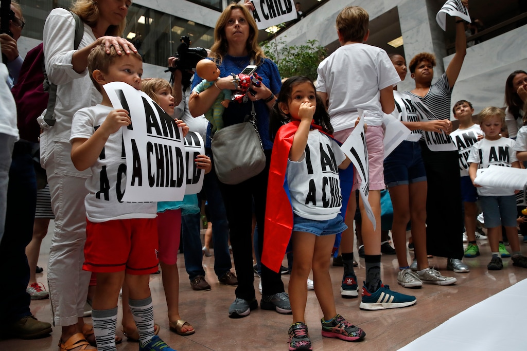 (Jacquelyn Martin | The Associated Press) Areva Gopal, 3, of Arlington, Va., center, attends a protest of families asking for the reunification of immigrant families who were separated at the border, Thursday, July 26, 2018, on Capitol Hill in Washington. The Trump administration faces a court-imposed deadline Thursday to reunite thousands of children and parents who were forcibly separated at the U.S.-Mexico border, an enormous logistical task brought on by its "zero tolerance" policy on illegal entry.