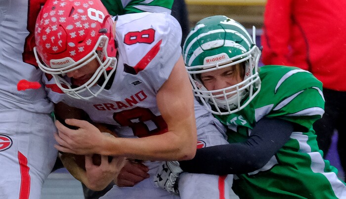 (Leah Hogsten  |  The Salt Lake Tribune)  South Summit's Dillon Crawford brings down Grand County's Trent Elmore.  South Summit High School boys' football team defeated Grand County High School 47-9 during their class 2A state semifinal football game Saturday, November 4, 2017 at Weber State University's Stewart Stadium.
