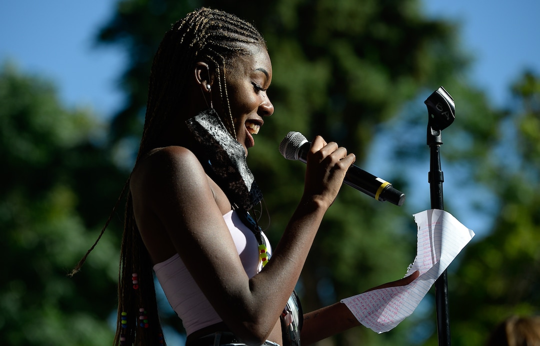(Francisco Kjolseth  |  The Salt Lake Tribune) Simone Wrathall reads some words she wrote about her experience being black as she joins the Juneteenth celebration at Washington Square in Salt Lake City on Friday, June 19, 2020.