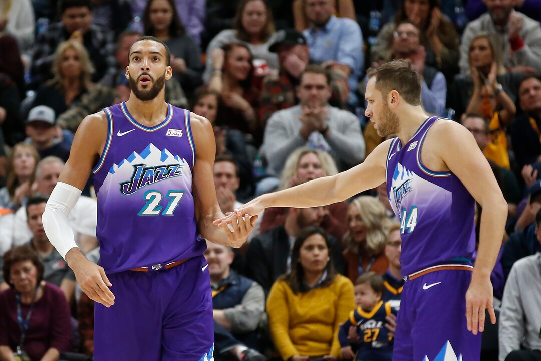 Utah Jazz's Bojan Bogdanovic (44) congratulates Rudy Gobert (27) after scoring against the Golden State Warriors in the first half during an NBA basketball game Friday, Nov. 22, 2019, in Salt Lake City. (AP Photo/Rick Bowmer)