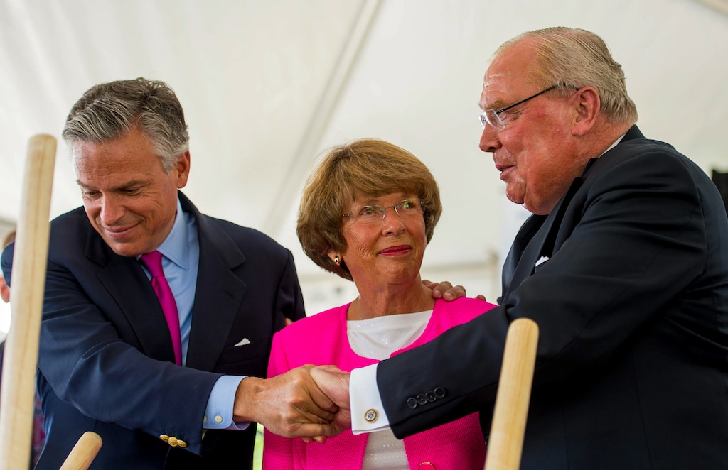 (Trent Nelson | The Salt Lake Tribune) From left, Jon Huntsman Jr., Karen Huntsman and Jon Huntsman Sr. embrace at a 2014 groundbreaking ceremony for a new wing of the Huntsman Cancer Institute.