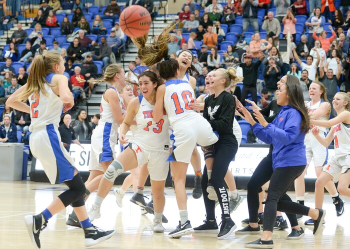 (Leah Hogsten  |  The Salt Lake Tribune) Timpview celebrates the win.  Timpview defeated Skyline 56-49 in their semifinal game of the 5A High School Girls' Basketball Tournament at SLCC in Taylorsville, Friday, Feb. 23, 2018. 