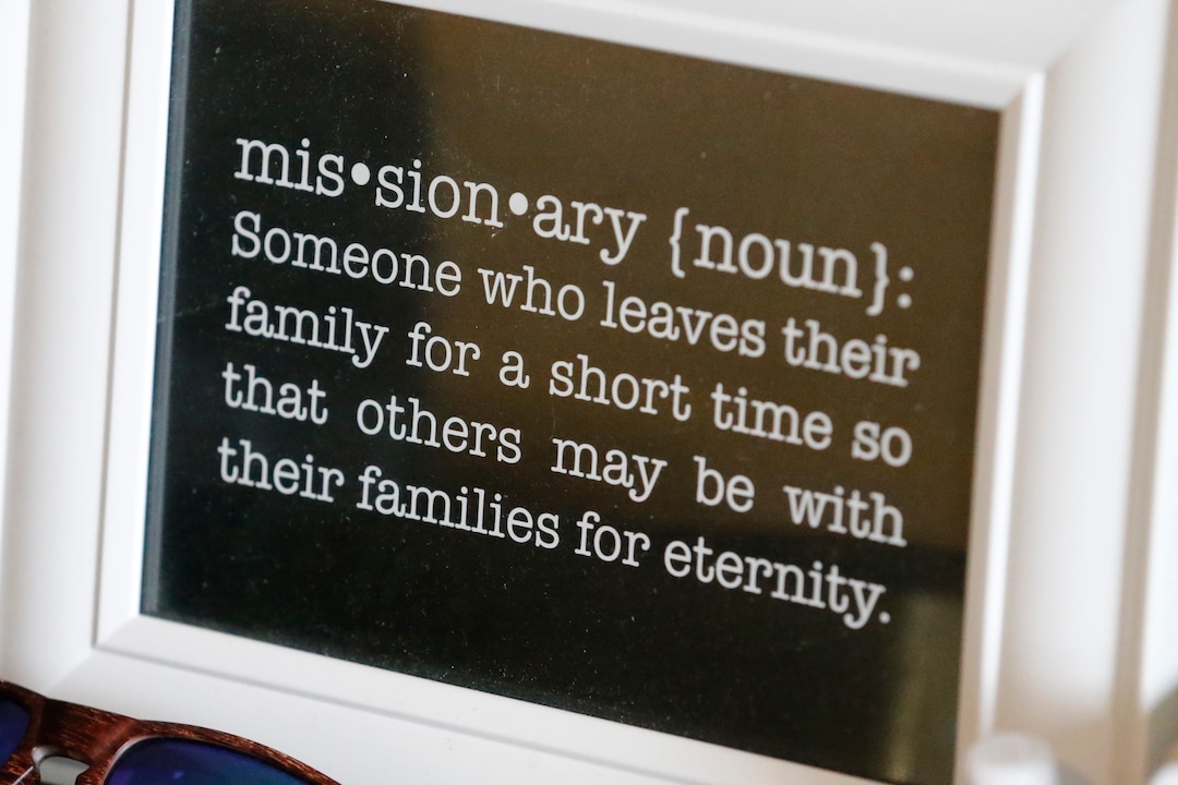 In this May 27, 2020, photo, a framed definition of missionary sits on a desk at the apartment of missionaries with The Church of Jesus Christ of Latter-day Saints, in Brigham City, Utah. After hastily bringing home 26,000 young men and women who were serving in foreign countries, the faith has begun sending many of them out again in their home countries with a new focus on online work that could stick even when the pandemic is over, church officials told The Associated Press. (AP Photo/Rick Bowmer)