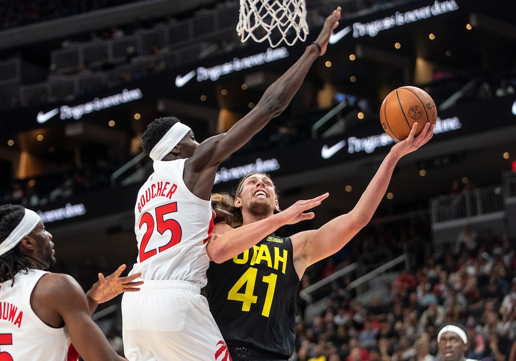 Utah Jazz's Kelly Olynyk (41) is blocked by Toronto Raptors' Chris Boucher (25) during first-half preseason NBA basketball game action in Edmonton, Alberta, Sunday, Oct. 2, 2022. (Jason Franson/The Canadian Press via AP)