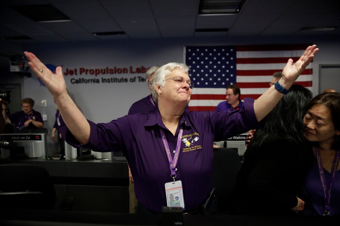 Flight director Julie Webster reacts in mission control at NASA's Jet Propulsion Laboratory after confirmation of Cassini's demise Friday, Sept. 15, 2017, in Pasadena , Calif. Cassini disintegrated in the skies above Saturn early Friday, following a remarkable journey of 20 years. (AP Photo/Jae C. Hong, Pool)