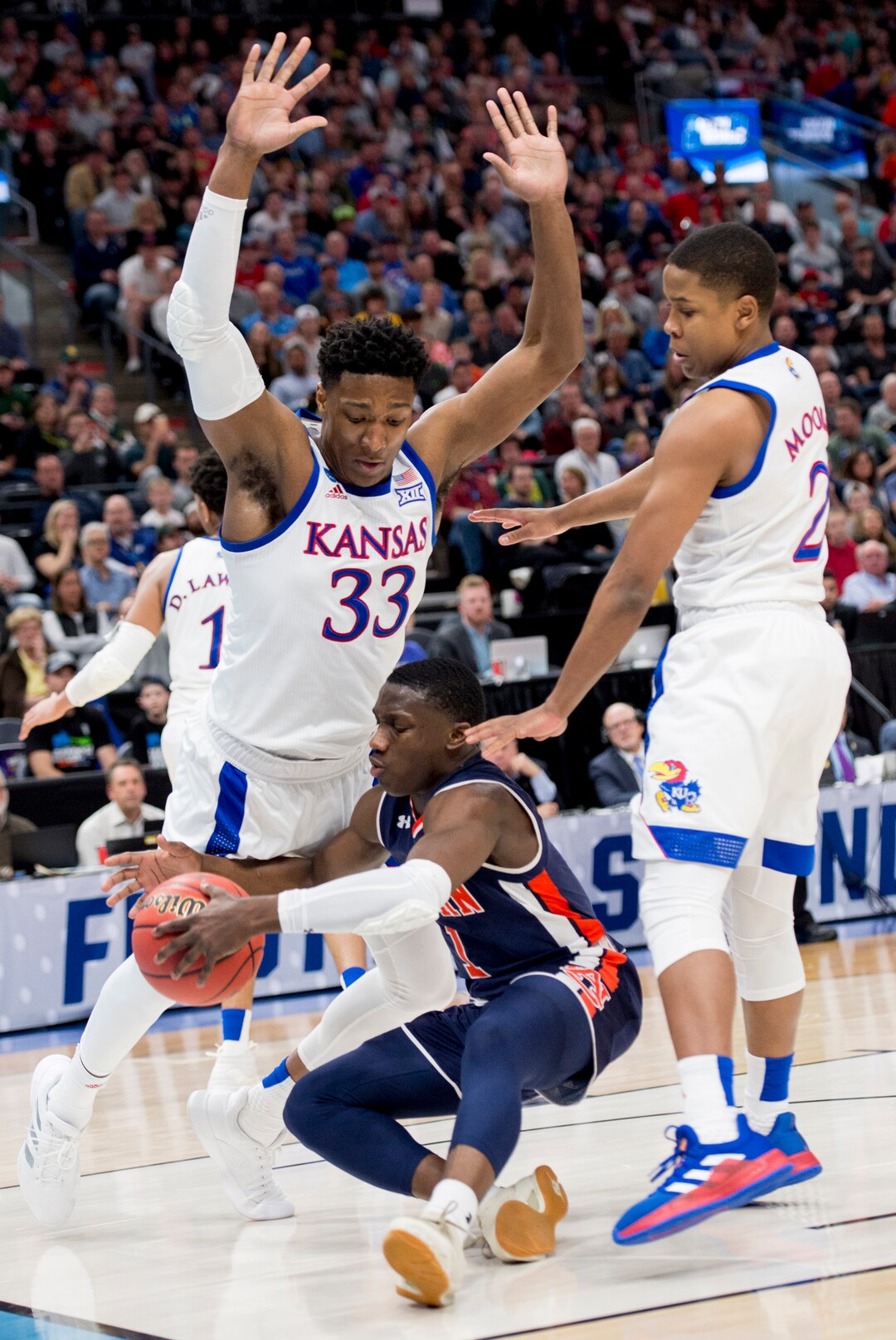 (Leah Hogsten  | The Salt Lake Tribune)  Auburn Tigers guard Jared Harper (1) tries to keep the ball away from Kansas Jayhawks forward David McCormack (33) and Kansas Jayhawks guard Charlie Moore (2) as Auburn faces Kansas in the second round of the NCAA tournament in Salt Lake City on Saturday, March 23, 2019.