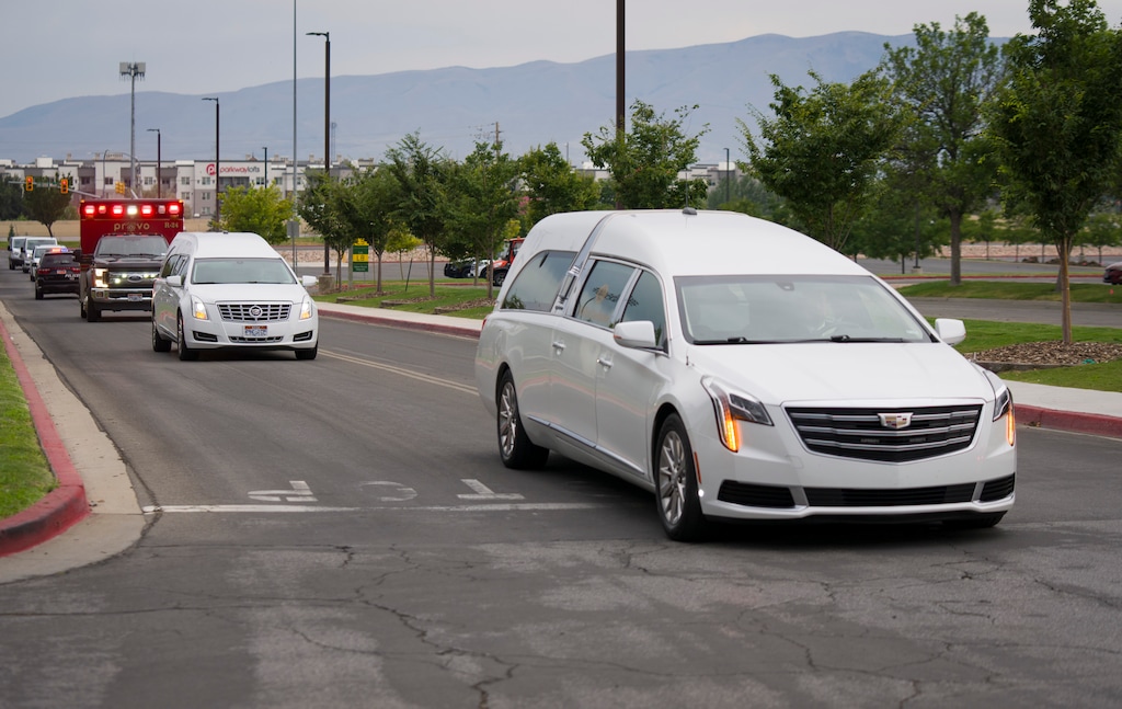 (Bethany Baker  |  The Salt Lake Tribune) The hearses arrive at Utah Valley University for the public memorial ceremony for Provo Fire Capt. Spencer Long, his wife Katrina, and their sons, Reid, Thayne and Gage, in Orem on Wednesday, July 29, 2026. The family died after a flash flood hit the area where they were camping and canyoneering.