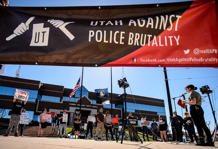 (Trent Nelson | The Salt Lake Tribune)
Utah Against Police Brutality holds a rally in front of West Valley City Hall, Saturday April 21, 2018. Elijah Smith was killed by West Valley Police on April 8 after he ran from them into a home. They shot him in the home's garage, while one hand was in the air and the other, activists say, appeared to be coming up, too. After body camera footage was released, the group began to call for the officer's firing.