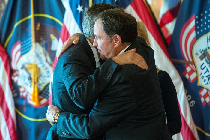 (Chris Detrick  |  The Salt Lake Tribune)  Gov. Gary R. Herbert swears in Jon M. Huntsman, Jr. as U.S. Ambassador to Russia during an Ambassadorial Swearing in Ceremony at the Utah Capitol Saturday, October 7, 2017. Mary Kaye Huntsman is in the middle.