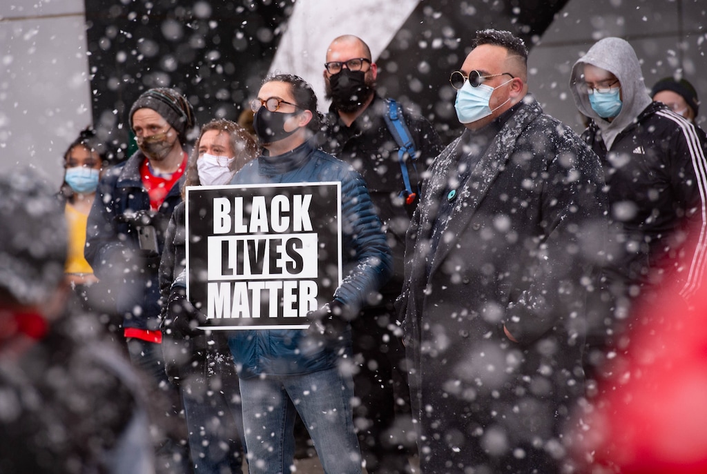 (Francisco Kjolseth  | The Salt Lake Tribune) Snow falls during a rally at the Federal Building in Salt Lake City on Martin Luther King Jr. Day, Monday, Jan. 18, 2021.