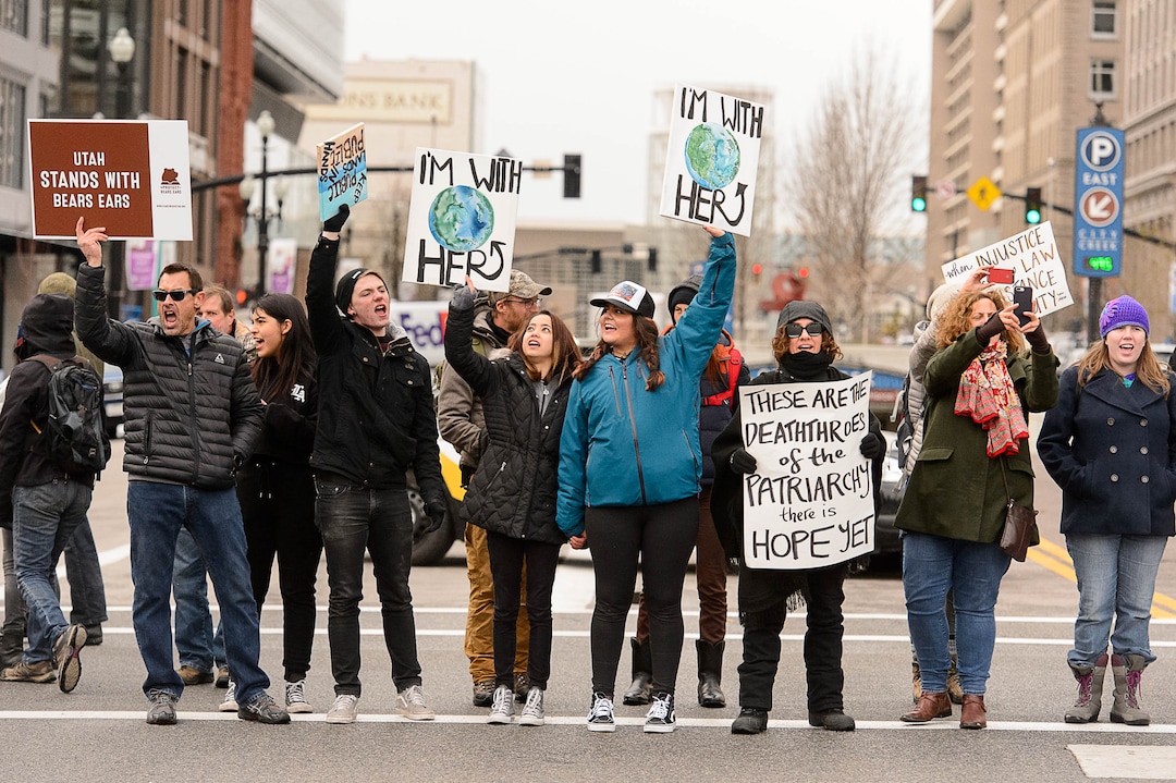 (Trent Nelson | The Salt Lake Tribune)  Protesters block off an intersection downtown after a rally against a visit by President Donald Trump, Monday December 4, 2017.