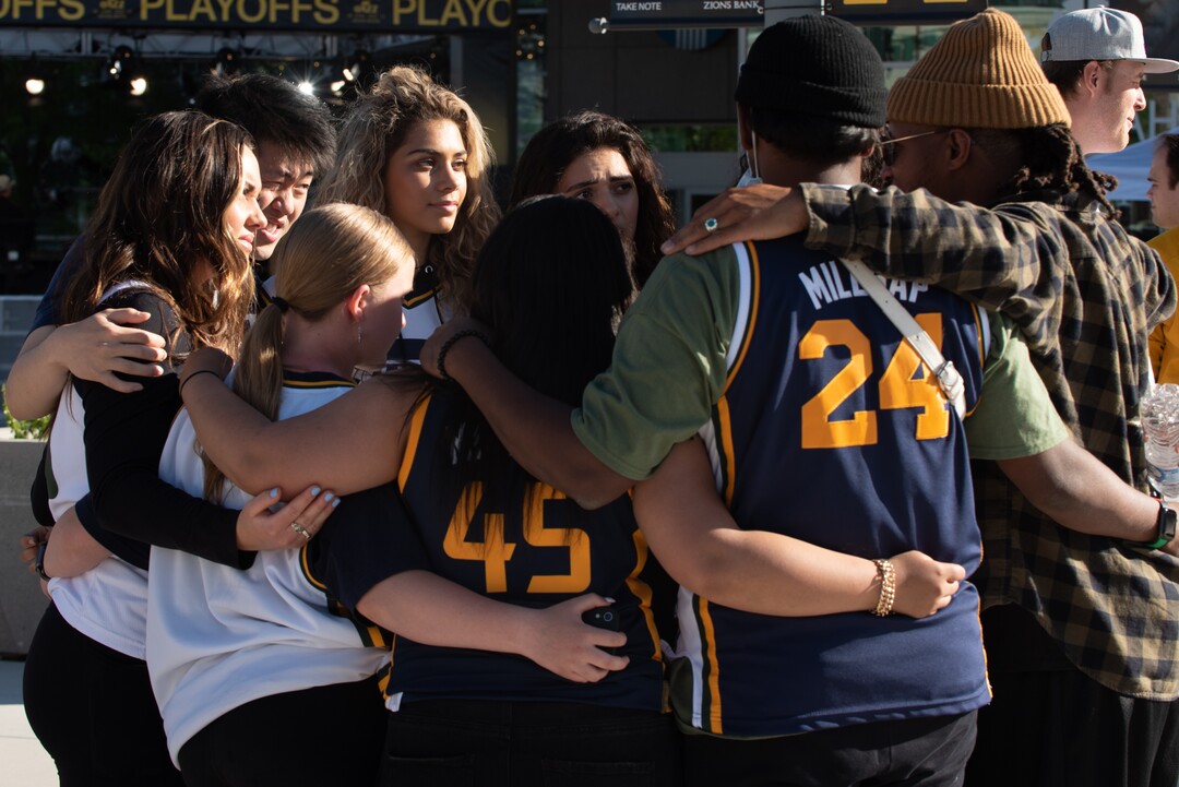 (Briana Scroggins | Special to The Tribune) Members of Millennium Dance Complex SLC huddle up and discuss their intentions tbefore dancing outside of Vivint Smart Home Arena before the Jazz play the Memphis Grizzlies in Salt Lake City on Wednesday, May 26, 2021.