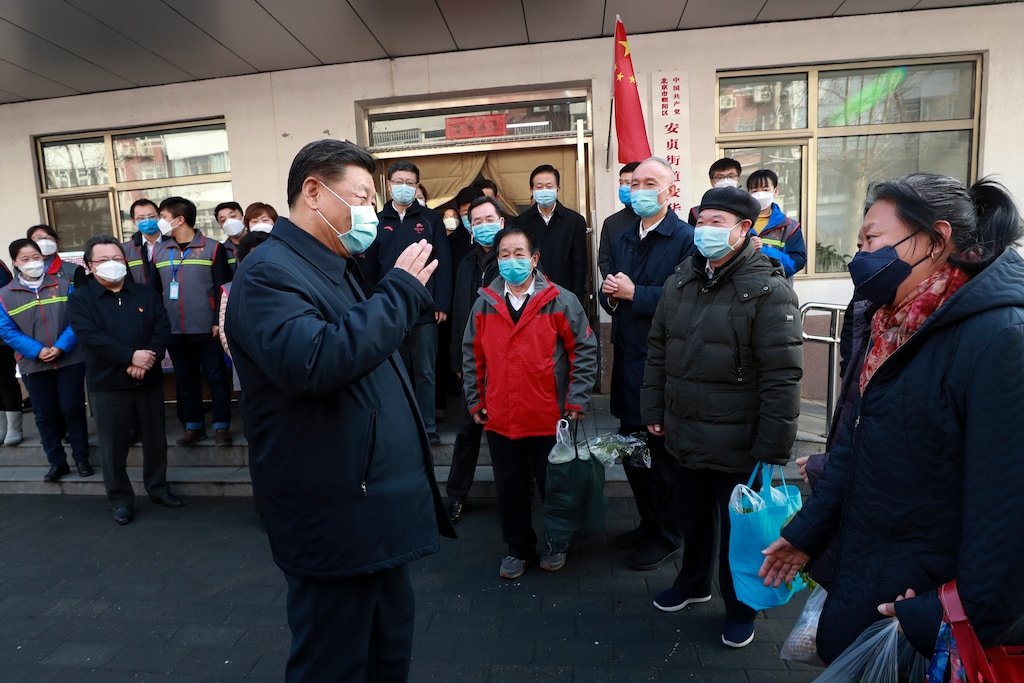 (Pang Xinglei | Xinhua via AP) In this photo released by Xinhua News Agency, Chinese President Xi Jinping wearing a protective face mask speaks to residents as he inspects the novel coronavirus pneumonia prevention and control work at a neighborhoods in Beijing, Monday, Feb. 10, 2020. China reported a rise in new virus cases on Monday, possibly denting optimism that its disease control measures like isolating major cities might be working, while Japan reported dozens of new cases aboard a quarantined cruise ship.