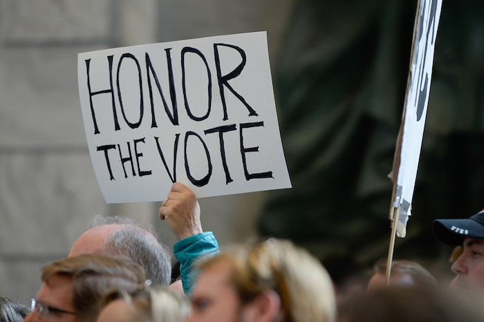 (Francisco Kjolseth  |  The Salt Lake Tribune)  Over 300 demonstrators fill the Capitol rotunda on Monday, Jan, 28, 2019, on the first day of the Legislative session to rally in support of protecting Proposition 3, the Medicaid Expansion law recently passed by voters.
