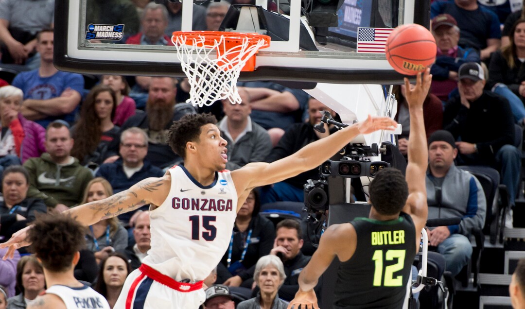 (Leah Hogsten  | The Salt Lake Tribune)  Baylor Bears guard Jared Butler (12) shoots over Gonzaga Bulldogs forward Brandon Clarke (15) as Baylor faces Gonzaga in the second round of the NCAA tournament in Salt Lake City on Saturday, March 23, 2019.