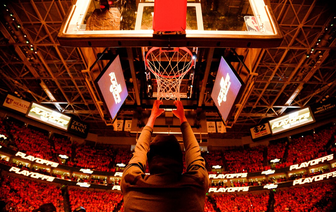 (Francisco Kjolseth  |  The Salt Lake Tribune)  Utah Jazz forward Thabo Sefolosha (22) does his ritualistic hang off the net as flames lite up the arena prior to Game 3 of a first-round NBA basketball playoff series against the Rockets in Salt Lake City, Saturday, April 20, 2019.