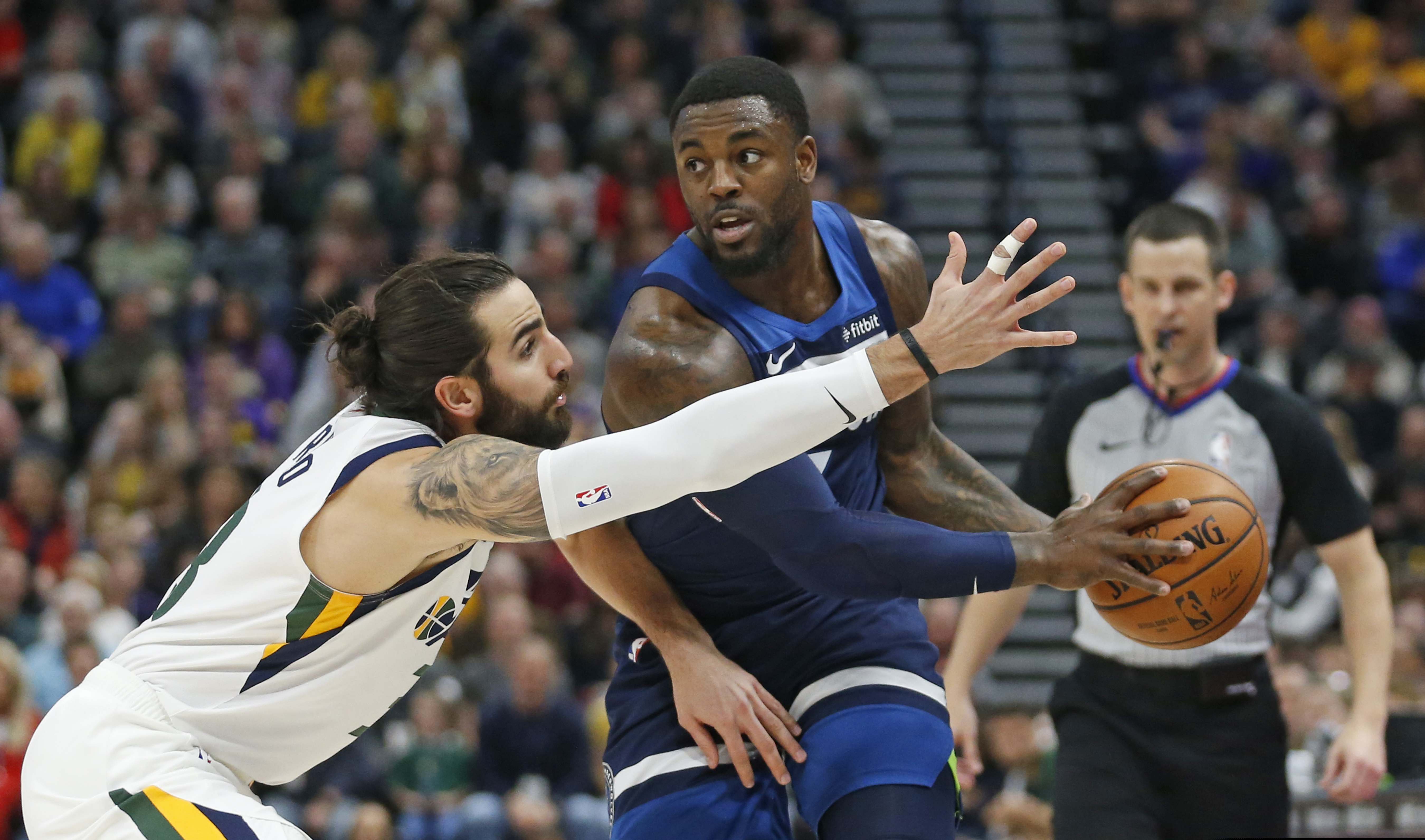 (AP Photo/Rick Bowmer) Utah Jazz guard Ricky Rubio, left, defends against Minnesota Timberwolves guard Jared Terrell during the first half of an NBA basketball game Friday, Jan. 25, 2019, in Salt Lake City.