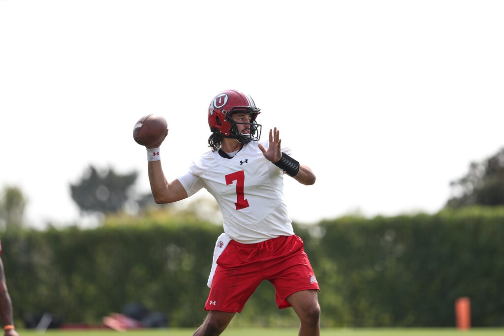 Utah quarterback Cameron Rising attempts a pass during practice on Wednesday. Rising is in a fall camp quarterback competition with Charlie Brewer