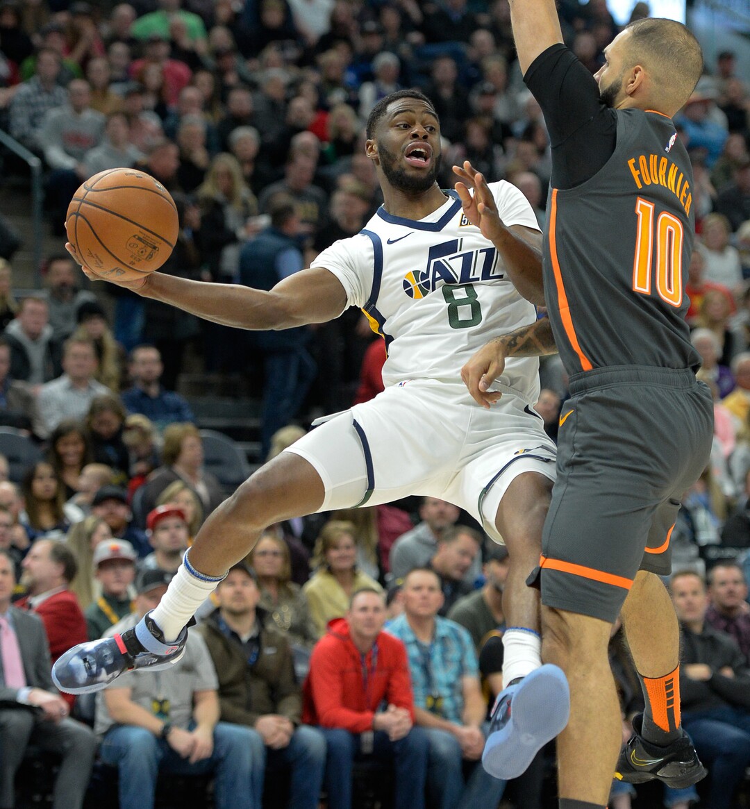 (Francisco Kjolseth  |  The Salt Lake Tribune) Utah Jazz guard Emmanuel Mudiay (8) passes to a teammate past Orlando Magic guard Evan Fournier (10) as the Utah Jazz host the Orlando Magic in their NBA basketball game at Vivint Smart Home Arena in Salt Lake City on Tuesday. Dec. 17, 2019.