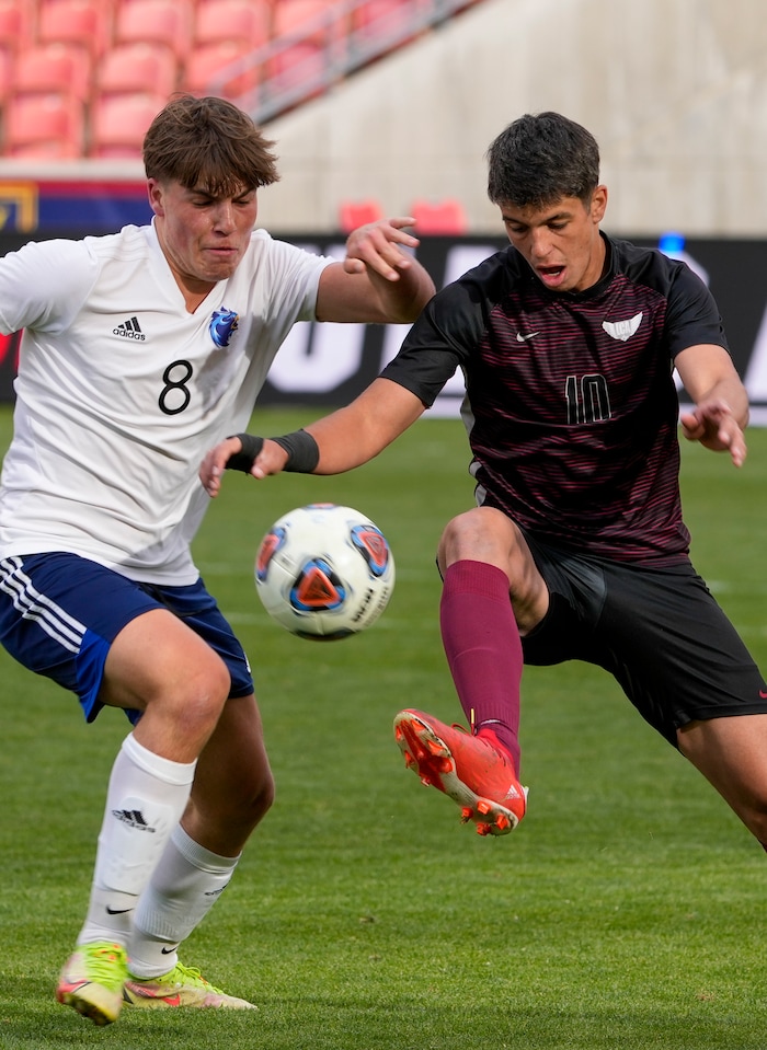 (Leah Hogsten | The Salt Lake Tribune) Real's Noe Vandamme battles Layton's Enzo Jaques as Real Salt Lake Academy meets Layton Christian Academy for the 3A State Soccer Championship title at Rio Tinto Stadium, Wednesday, May 11, 2022. Layton Christian Academy won the title 4-0. 