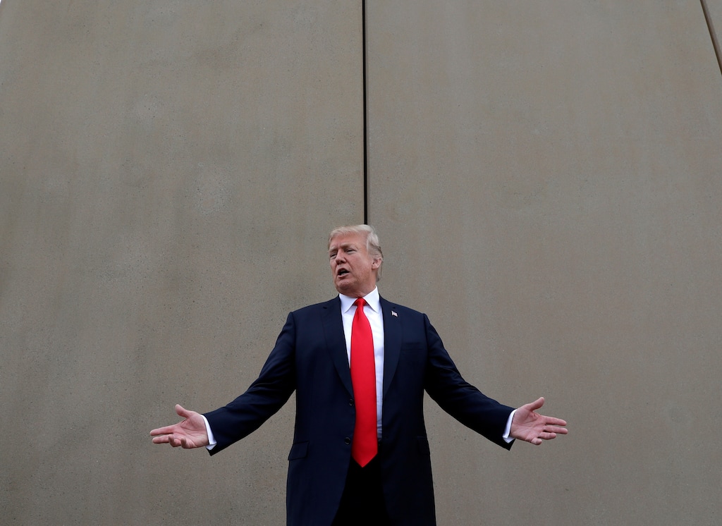 (Evan Vucci | The Associated Press) In this March 13, 2018, file photo, President Donald Trump speaks during a tour as he reviews border wall prototypes in San Diego. Trump said Sunday, July 29, 2018, that he would consider shutting down the government if Democrats refuse to vote for his immigration proposals, including building a wall along the U.S.-Mexico border.