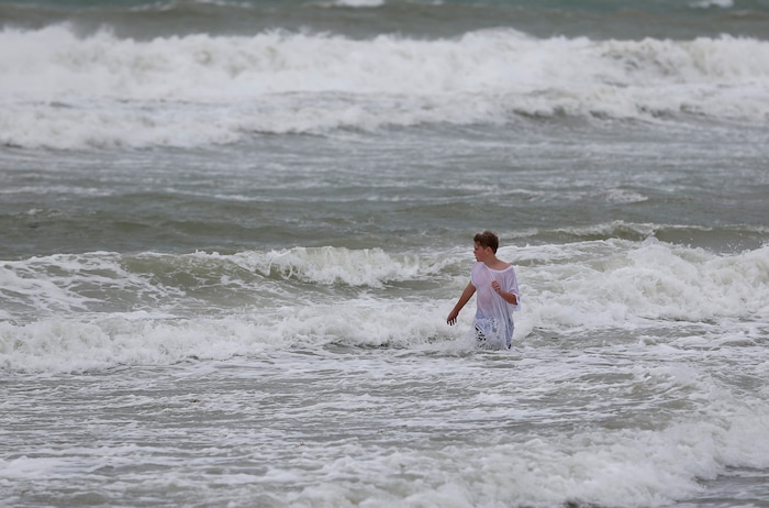 (AP Photo/Wilfredo Lee) A young boy plays in the waves churned up by Hurricane Irma on Hollywood Beach, Saturday, Sept. 9, 2017, in Fort Lauderdale, Fla.