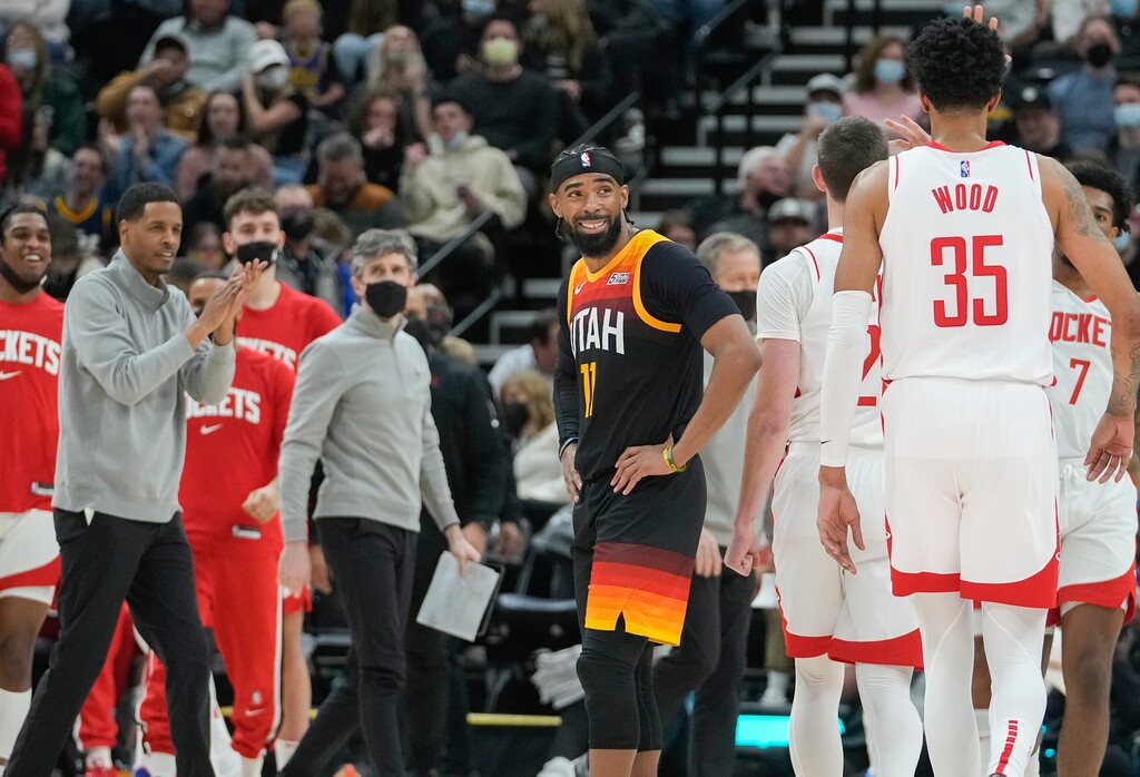 (Leah Hogsten | The Salt Lake Tribune)  Utah Jazz guard Mike Conley (11) looks back to Houston Rockets center Christian Wood (35) who sunk a 3-pointer at the end of the third quarter as the Utah Jazz host the Houston Rockets at Vivint Arena, Jan. 18, 2022. 