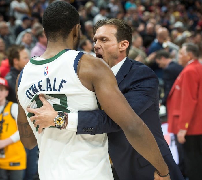 (Rick Egan  |  The Salt Lake Tribune)  Utah Jazz forward Royce O'Neale (23) gets a hug from Utah Jazz head coach Quin Snyder, as theJazz defeat the Spurs 101-99 for their 10th win in a row, in NBA action in Salt Lake City, Monday, February 12, 2018.