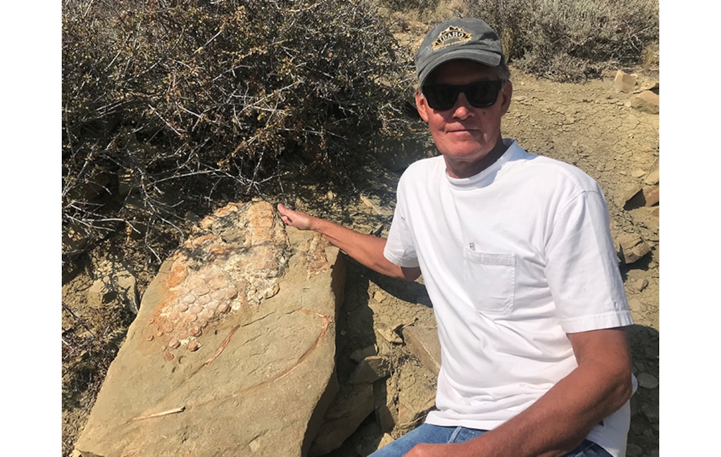 (Utah Division of Parks and Recreation) Hooper resident Alan Dailey with the fossilized ichthyosaur he found at Flaming Gorge Reservoir.