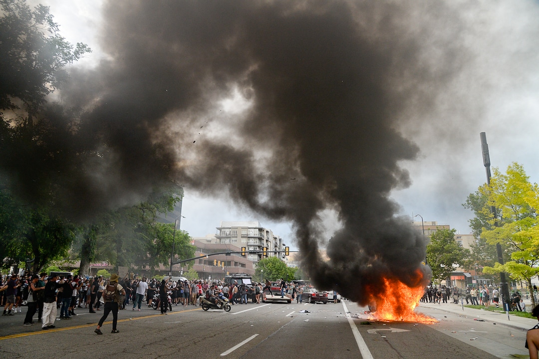 (Francisco Kjolseth  |  The Salt Lake Tribune) Protesters set a fire during a protest after the death of George Floyd on May 30, 2020.