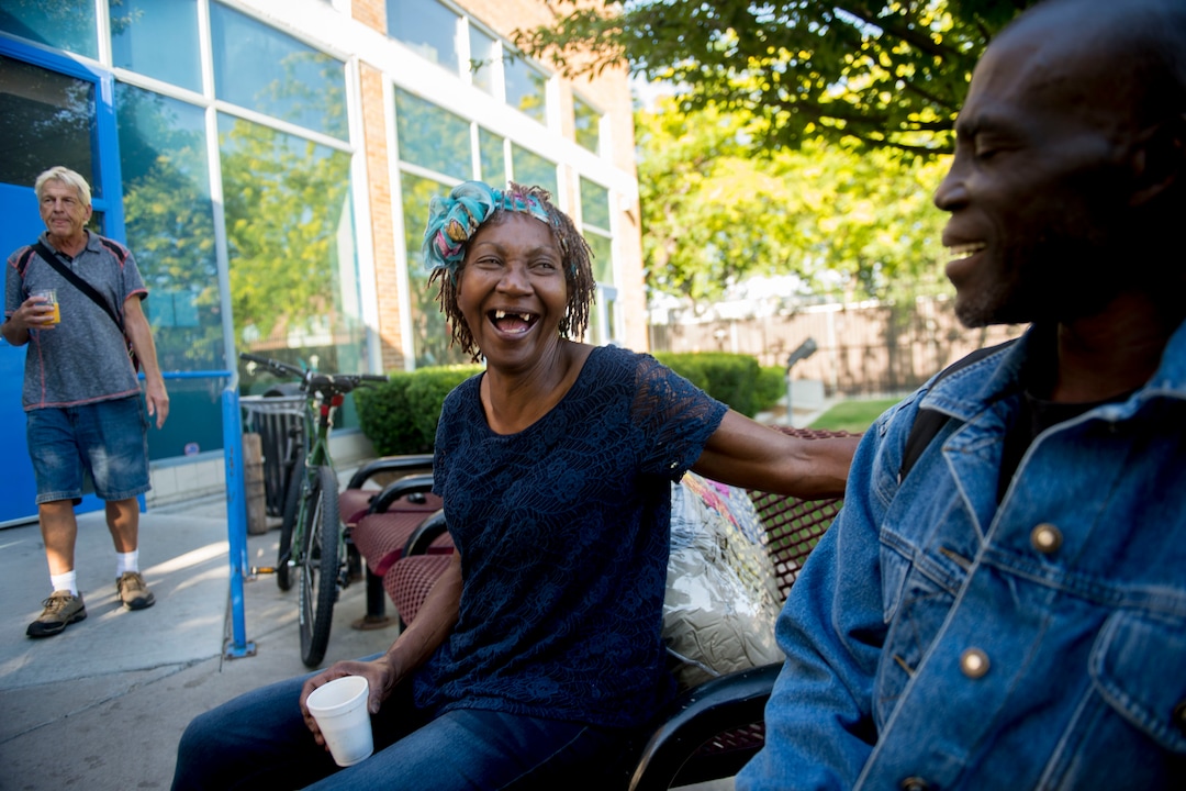 (Jeremy Harmon |  The Salt Lake Tribune) Sharon Thompson laughs with her friend Henry Glen as they sit outside the Weigand Center on July 11, 2019.